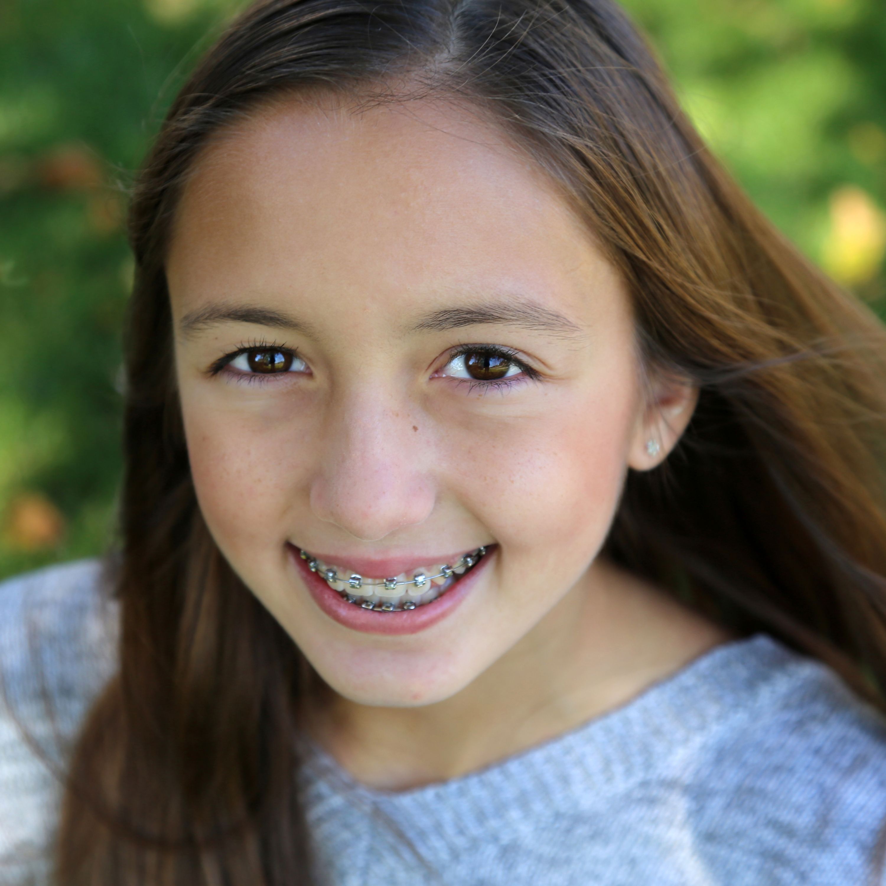 A young girl with braces